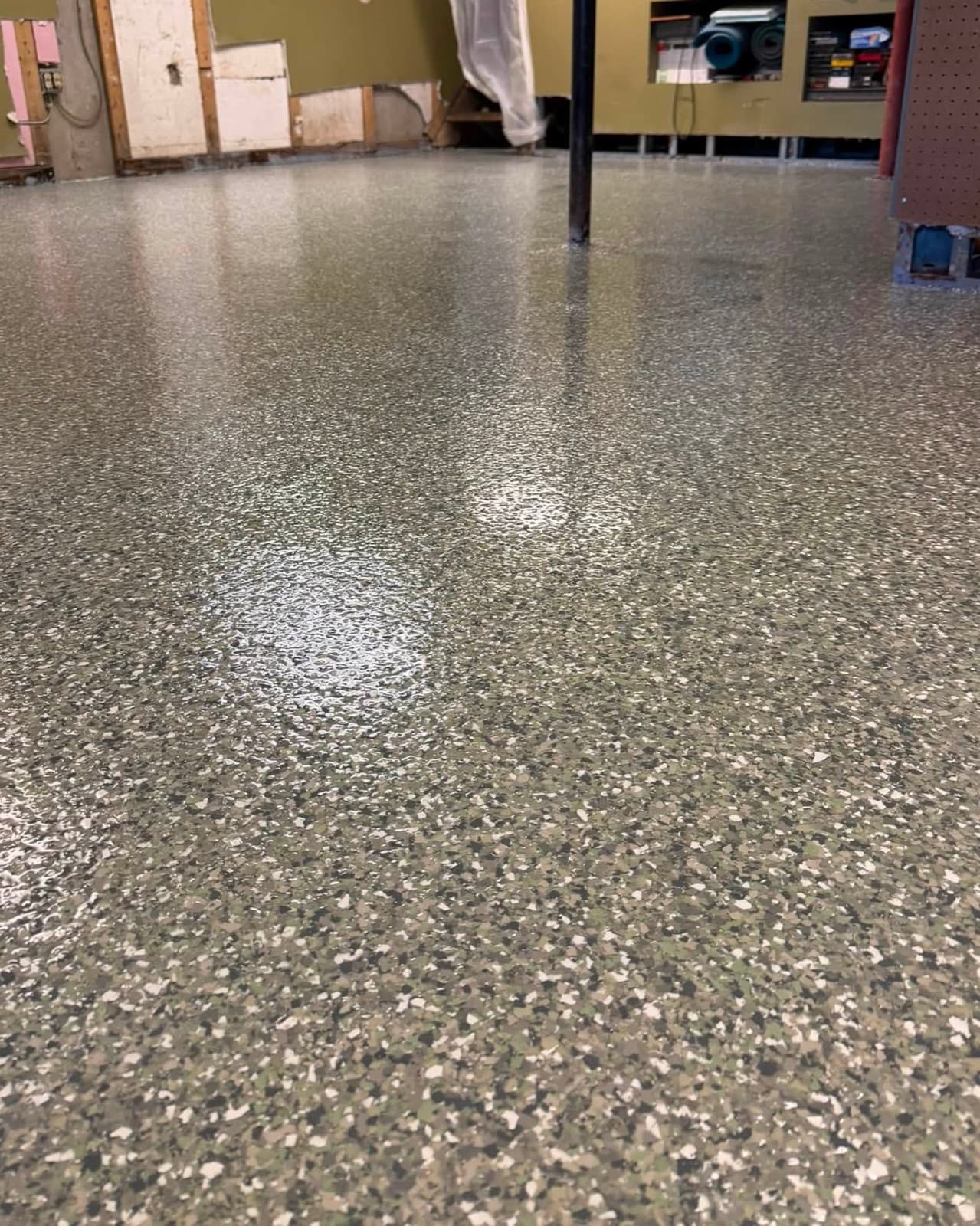 Flake basement floor finished by Raines Epoxy